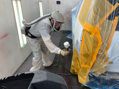 Body shop employee working